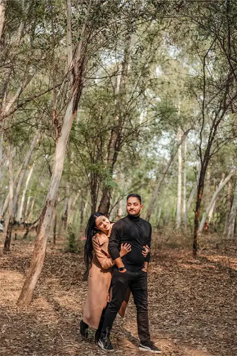Candid couple portrait inside Chaksu Forest trees background Jaipur