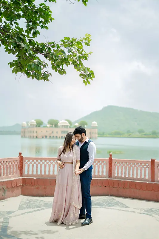 Romantic couple portrait at Jal Mahal water palace in Jaipur for pre wedding photography