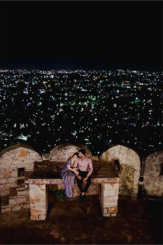 Sunset couple shoot with full city skyline from Padao Restaurant at Nahargarh Fort