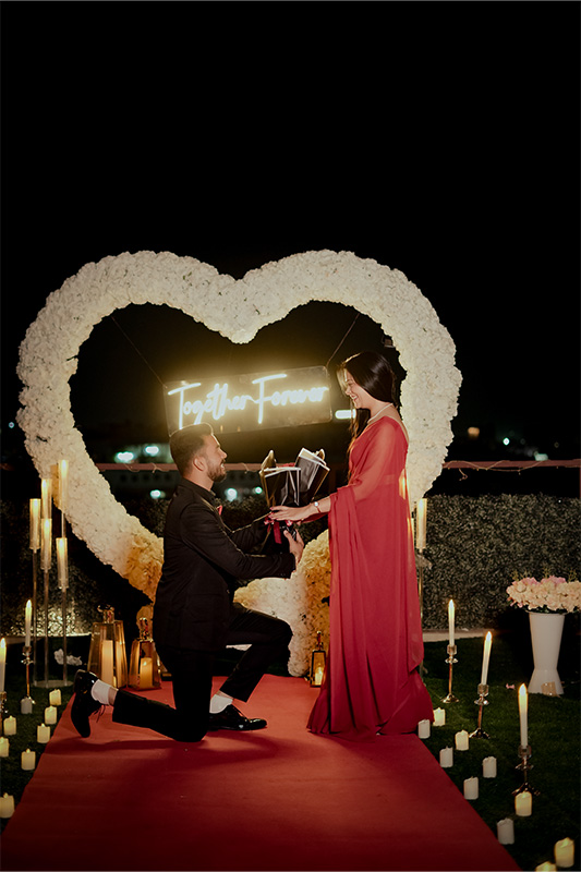 Romantic candlelit marquee proposal setup photography in Jaipur for couples